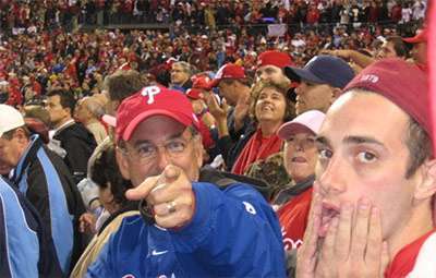 Ethan and his dad playing around for the camera at a Phillies game. 