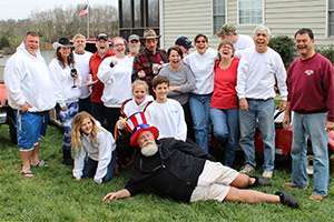 The polar plunge team gathers for a photo – cozy and warm in their sweatshirts – lakeside in Mineral, Virginia.