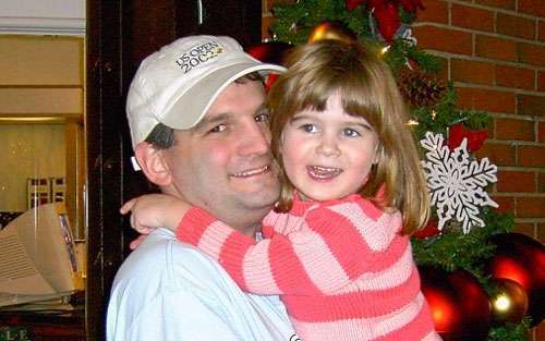 Nikki Cronin as a child hugging her dad, Dennis, who is now a seven-year pancreatic cancer survivor.