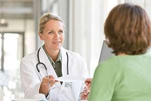 Doctor and patient discuss types of treatment for pancreatic cancer.