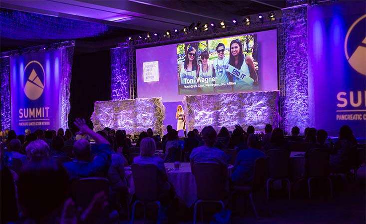 Attendees at PanCAN leadership and scientific meeting gather for a presentation.