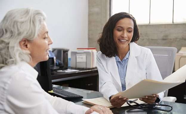Pancreatic cancer patient reviews her molecular profile report with her doctor