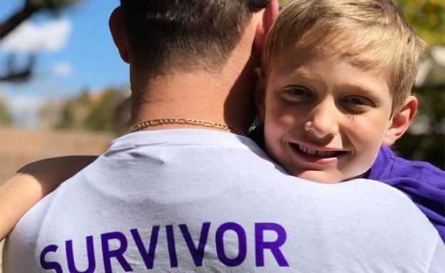 Pancreatic cancer survivor with young son at PurpleStride Las Vegas fundraiser